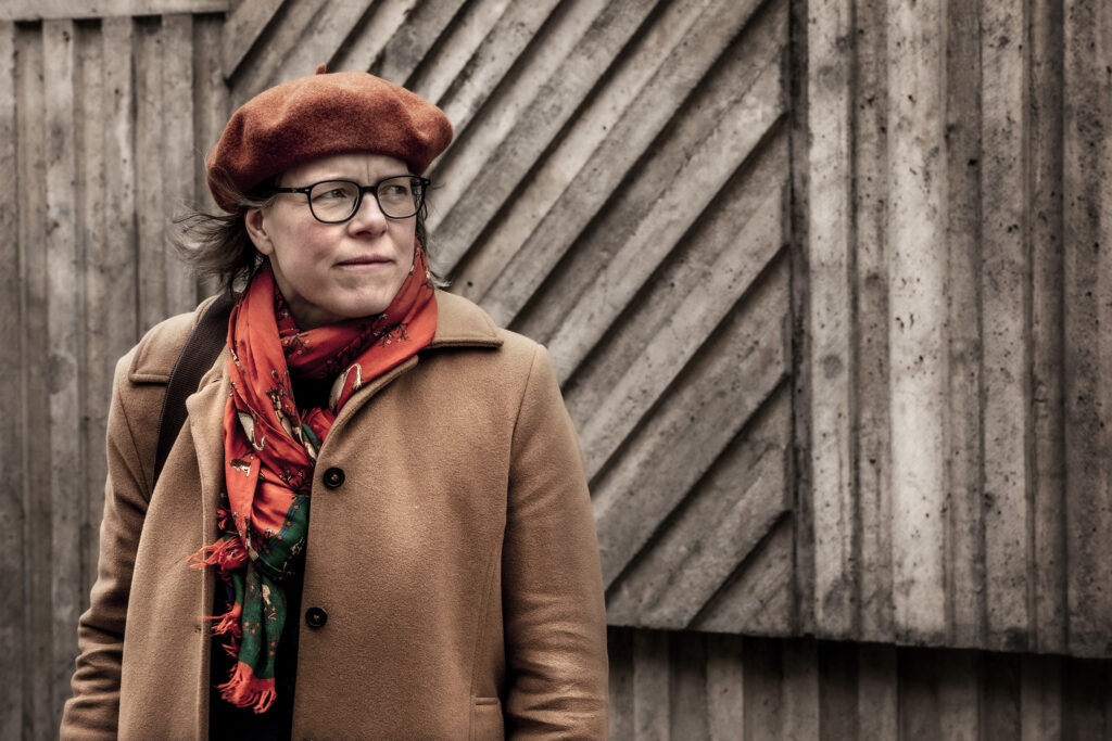 Lena Andersson in an outdoor photo, facing the wind.